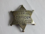 Obsolete Colorado Child Animal Protection Badge. Fixed Price $399.99.