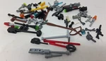 Lego Bulk Lot Tiny Pieces 1.2 Oz Weapons Tools Light Droid Arms Multicolor As Pi. Fixed Price $5.00.